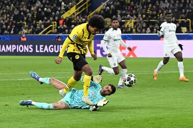 Karim Adeyemi Borussia Dortmund and goalkeeper Rui Silva Sporting Lisbon battle for the ball during the UEFA Champions League 2024 25 League Play offs second leg match between Borussia Dortmund and Sporting Lisbon, SIGNAL IDUNA PARK on February 19, 2025 in Dortmund, Germany, Germany Photo by Ralf Treese DeFodi Images Karim Adeyemi Borussia Dortmund and goalkeeper Rui Silva Sporting Lisbon battle for the ball during the UEFA Champions League 2024 25 League Knockout Play off Second Leg match between Borussia Dortmund and Sporting Clube de Portugal at Signal Iduna Park on February 19, 2025 in Dortmund, Germany Photo by Ralf Treese DeFodi Images Defodi-521