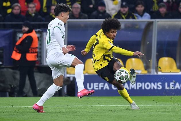 Soccer Champions League Play off Borussia Dortmund Sporting Lisbon on 19 02 2025 at Signal Iduna Park in Dortmund Maximiliano Araujo Lisbon , left Karim Adeyemi Dortmund , right xRx