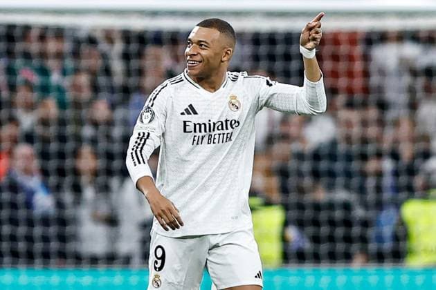Kylian Mbappà of Real Madrid celebrates scoring the opening goal for their side Real Madrid v Manchester City, UEFA Champions League, Knockout Round Play-offs, Second Leg, Football, Santiago BernaboÆ?Ã?Æ?o Ã? u, Madrid, Spain - 19 Feb 2025 EDITORIAL USE ONLY No use with unauthorised audio, video, data, fixture lists, club league logos or live services. Online in-match use limited to 120 images, no video emulation. No use in betting, games or single club league player publications. Copyright: xRubenxAlbarran Shutterstockx 15137179f