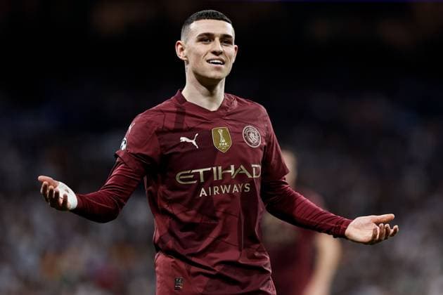Phil Foden of Manchester City appeals Real Madrid v Manchester City, UEFA Champions League, Knockout Round Play-offs, Second Leg, Football, Santiago BernaboÆ?Ã?Æ?o Ã? u, Madrid, Spain - 19 Feb 2025 EDITORIAL USE ONLY No use with unauthorised audio, video, data, fixture lists, club league logos or live services. Online in-match use limited to 120 images, no video emulation. No use in betting, games or single club league player publications. Copyright: xRubenxAlbarran Shutterstockx 15137179y