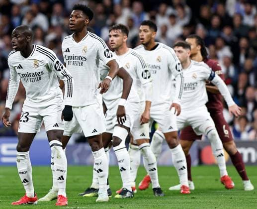 Ferland Mendy of Real Madrid (L) Real Madrid v Manchester City, UEFA Champions League, Knockout Round Play-offs, Second Leg, Football, Santiago BernaboÆ?Ã?Æ?o Ã? u, Madrid, Spain - 19 Feb 2025 EDITORIAL USE ONLY No use with unauthorised audio, video, data, fixture lists, club league logos or live services. Online in-match use limited to 120 images, no video emulation. No use in betting, games or single club league player publications. Copyright: xRubenxAlbarran Shutterstockx 15137179ab