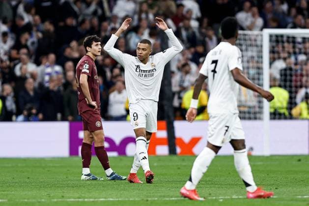 Kylian Mbappà of Real Madrid celebrates scoring a goal for their side to make it 2-0 Real Madrid v Manchester City, UEFA Champions League, Knockout Round Play-offs, Second Leg, Football, Santiago BernaboÆ?Ã?Æ?o Ã? u, Madrid, Spain - 19 Feb 2025 EDITORIAL USE ONLY No use with unauthorised audio, video, data, fixture lists, club league logos or live services. Online in-match use limited to 120 images, no video emulation. No use in betting, games or single club league player publications. Copyright: xRubenxAlbarran Shutterstockx 15137179ah