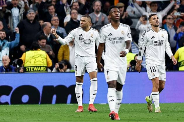 Kylian Mbappà of Real Madrid celebrates scoring a goal for their side to make it 2-0 Real Madrid v Manchester City, UEFA Champions League, Knockout Round Play-offs, Second Leg, Football, Santiago BernaboÆ?Ã?Æ?o Ã? u, Madrid, Spain - 19 Feb 2025 EDITORIAL USE ONLY No use with unauthorised audio, video, data, fixture lists, club league logos or live services. Online in-match use limited to 120 images, no video emulation. No use in betting, games or single club league player publications. Copyright: xRubenxAlbarran Shutterstockx 15137179ai