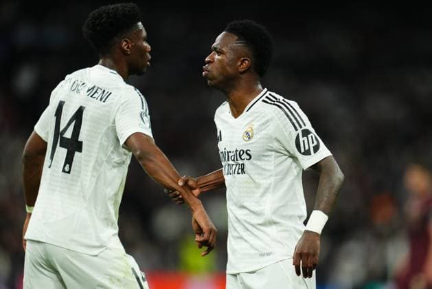 ESP: Real Madrid v Manchester City. UEFA Champions League match. Play off round Vinicius Junior and Aurelien Tchouameni of Real Madrid during the UEFA Champions League match, play off round, second leg, between Real Madrid and Manchester City played at Santiago Bernabeu Stadium on Feb 19, 2025 in Madrid Spain. kpng Copyright: xBaguxBlancox xPRESSINPHOTOx PS_250219_RMA_MCI_035