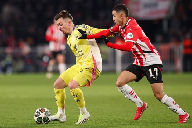 2025-02-19 PSV v Juventus - UEFA Champions League 2024 25 League Knockout Play-off Second Leg EINDHOVEN, NETHERLANDS - FEBRUARY 19: Francisco Conceicao of Juventus is challenged by Mauro Junior of PSV during the UEFA Champions League 2024 25 League Knockout Play-off Second Leg match between PSV and Juventus at Philips Stadion on February 19, 2025 in Eindhoven, Netherlands. Eindhoven Philips Stadion Netherlands Content not available for redistribution in The Netherlands directly or indirectly through any third parties. Copyright: xHansxvanxderxValkx