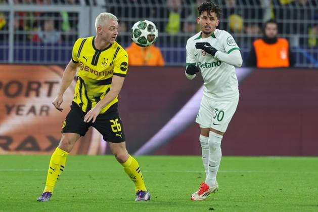 (250220) -- DORTMUND, Feb. 20, 2025 -- Julian Ryerson (L) of Borussia Dortmund vies with Gabriel Teixeira of Sporting CP during the UEFA Champions League knockout phase play-off second leg football match between Borussia Dortmund and Sporting CP in Dortmund, Germany, Feb. 19, 2025. (Photo by Xinhua) (SP)GERMANY-DORTMUND-FOOTBALL-UEFA CHAMPIONS LEAGUE-DORTMUND VS SPORTING CP JoachimxBywaletz 