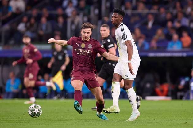 Real Madrid CF vs Manchester City in Madrid, Spain - 19 Feb 2025 Nico Gonzalez (L) of Manchester City and Aurelien Tchouameni (R) of Real Madrid CF seen in action during the 2024 2025 UEFA Champions League Knockout Play-off second leg match between Real Madrid CF and Manchester City at Santiago Bernabeu stadium. Final score Real Madrid CF 3 : 1 Manchester City Madrid Spain Copyright: xFedericoxTitonex xSOPAxImagesx FTITONE_0021