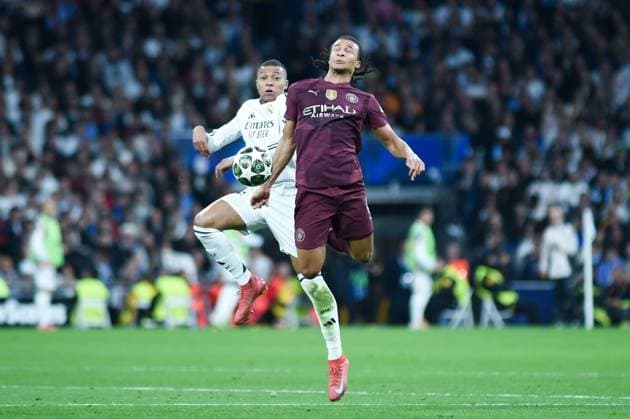 (250220) -- MADRID, Feb. 20, 2025 -- Kylian Mbappe (L) of Real Madrid vies with Nathan Ake of Manchester City during the UEFA Champions League knockout phase play-off second leg football match between Real Madrid and Manchester City in Madrid, Spain, on Feb. 19, 2025. (Photo by Xinhua) (SP)SPAIN-MADRID-FOOTBALL-UEFA CHAMPIONS LEAGUE-REAL MADRID VS MANCHESTER CITY GustavoxValiente 