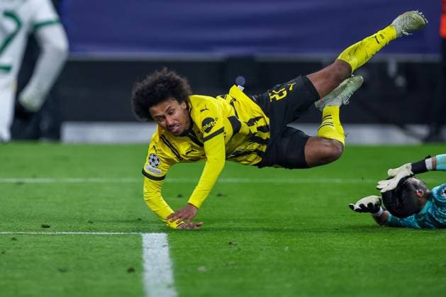 19 02 2025, Football, UEFA Champions League, Borussia Dortmund Sporting Lisbon, Signal Iduna Park, Knockout phase play offs, 2024 2025 season Karim Adeyemi BVB 27 flies through the air in the penalty area after being fouled by goalkeeper Rui Silva Sporting 24 North Rhine-Westphalia Germany