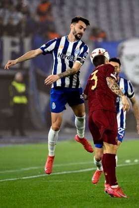 Fabio Vieira of FC Porto and Jose Angel Esmoris Tasende Angelino of AS Roma during the Europa League football match between AS Roma and FC Porto at Olimpico stadium in Rome (Italy), February 20, 2025. andreaxstaccioli