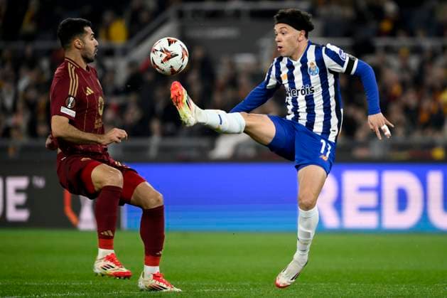 Mehmet Zeki Celik of AS Roma and Eduardo Gabriel Aquino Cossa of FC Porto compete for the ball during the Europa League football match between AS Roma and FC Porto at Olimpico stadium in Rome (Italy), February 20, 2025. andreaxstaccioli