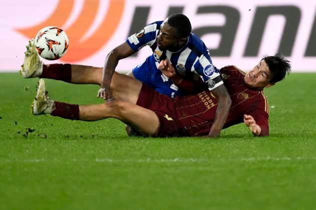 Otevio Edmilson da Silva Monteiro of FC Porto and Eldor Shomurodov of AS Roma compete for the ball during the Europa League football match between AS Roma and FC Porto at Olimpico stadium in Rome (Italy), February 20, 2025. andreaxstaccioli