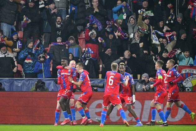 Plzen players celebrate after scoring a goal, goal scorer Rafiu Durosinmi of Plzen, left, during the UEFA Europa League, 2nd round match: FC Viktoria Plzen vs Ferencvaros Budapest, in Pilsen, Czech Republic, on February 20, 2025. (CTKxPhoto VitxSimanek) CTKPhotoP2025022008989  CTKPhotoP2025022008989