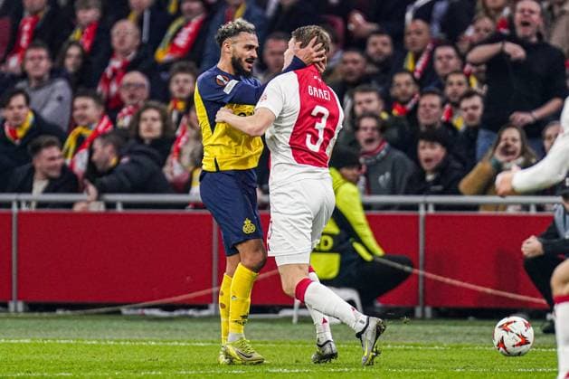 2025-02-20 AFC Ajax v R. Union Saint-Gilloise - UEFA Europa League 2024 25 League Knockout Play-off Second Leg AMSTERDAM, NETHERLANDS - FEBRUARY 20: Sofiane Boufal of R. Union Saint-Gilloise, Anton Gaaei of AFC Ajax fighting during the UEFA Europa League 2024 25 League Knockout Play-off Second Leg match between AFC Ajax and R. Union Saint-Gilloise at Johan Cruijff Arena on February 20, 2025 in Amsterdam, Netherlands. Amsterdam Johan Cruijff Arena Netherlands Content not available for redistribution in The Netherlands directly or indirectly through any third parties. Copyright: xJorisxVerwijstx