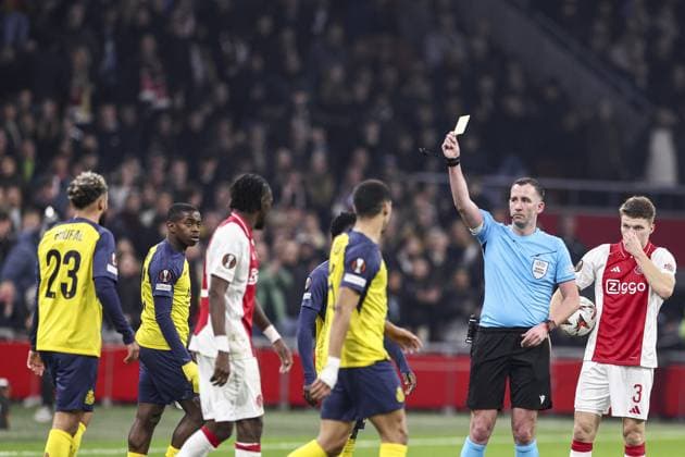 AMSTERDAM , 20-02-2025 , JohanCruijff Arena , season 2024 2025 , Europa League football , match second leg between Ajax and Union Saint Gilloise Union Saint-Gilloise player Sofiane Boufal get a yellow card from referee Chris Kavanagh Ajax - Union Saint Gilloise  x27957662x Copyright:
