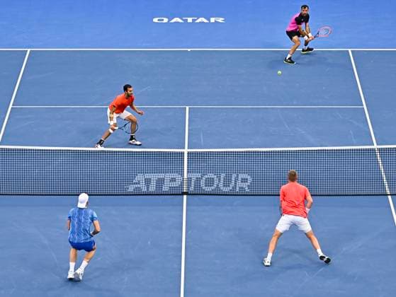 ATP, Tennis Herren QATAR EXXONMOBIL OPEN Ulian Cash and Lloyd Glasspool of Great Britain (bottom) compete during men s doubles Semifinals match against Yuki Bhambri of India and Ivan Dodig of Croatia at the ATP Qatar ExxonMobil Open 2025 tennis tournament at the Khalifa International Tennis Complex in Doha, Qatar on February 21, 2025. DOHA Qatar Copyright: xNOUSHADx