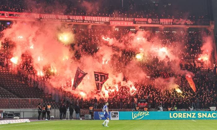 Berlin, 21 02 2025, Soccer, 2 Bundesliga, Matchday 23, Hertha BSC 1 FC Nuernberg, Olympiastadion Fans of 1 FC Nuernberg ignite Bengal fire in the visitors block of the stadium DFL regulations and DFB regulations prohibit any use of photographs as image sequences and or quasi video, Foto Andreas Gora Hertha BSC 1 FC Nuernberg