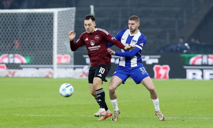 Julian Justvan on the ball, Marton Dardai duel Match scene Action Sport Football Soccer DFL 2 Bundesliga Men 23 Matchday Season 2024 2025 21 02 2025 Hertha BSC Berlin vs 1 FC Nürnberg FCN DFL regulations prohibit any use of photographs as image sequences and or quasi video