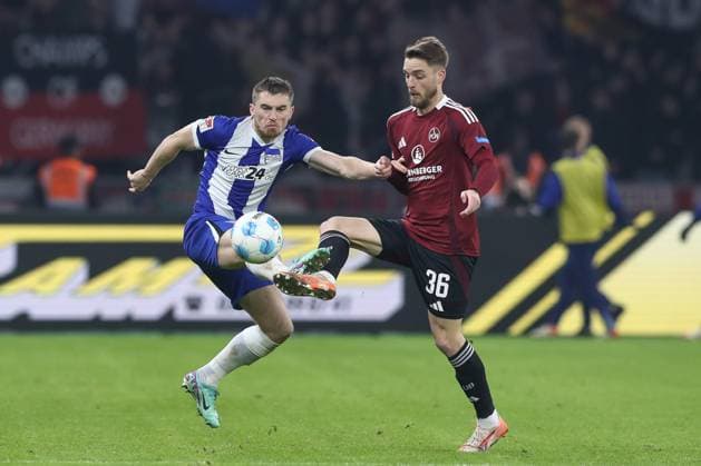 21 02 2025, xtgx, Soccer 2 Bundesliga, Hertha BSC Berlin 1 FC Nuernberg emspor, v l Jonjoe Kenny Hertha, 16 , Lukas Schleimer Nuernberg, 36 duel, duel, fight, tackle DFL DFB REGULATIONS PROHIBIT ANY USE OF PHOTOGRAPHS as IMAGE SEQUENCES and or QUASI VIDEO Berlin