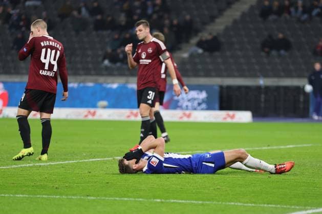2 Soccer Bundesliga Hertha BSC 1 FC Nuremberg Florian Niederlechner Hertha BSC Berlin 7 disappointed on the ground, left Ondrej Karafiat Nuremberg 44 , during the match in the 2 Soccer Bundesliga Hertha BSC 1 FC Nuremberg in Berlin, Olympiastadion, on 21 02 2025 DFB regulations prohibit any use of photographs as image sequences and or quasi video Copyright: xBEAUTIFULxSPORTS Frankex