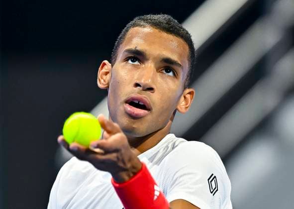 (250222) -- DOHA, Feb. 22, 2025 -- Felix Auger-Aliassime of Canada serves during the men s singles semifinal match against Andrey Rublev of Russia at the ATP, Tennis Herren Qatar Open tennis tournament in Doha, Qatar, Feb. 21, 2025. (Photo by Xinhua) (SP)QATAR-DOHA-TENNIS-ATP QATAR OPEN 2025-MEN S SINGLES Nikku 