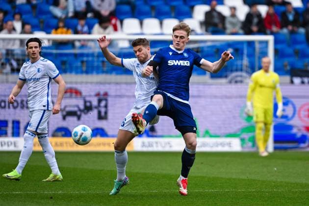 Mikkel Kaufmann Karlsruher SC and Marcus Mathisen 1 FC Magdeburg battle for the ball during the 2 Bundesliga match between Karlsruher SC and 1 FC Magdeburg at BBBank Wildpark on February 22, 2025 in Karlsruhe, Germany, Germany Photo by Silas Schüller DeFodi Images Mikkel Kaufmann Karlsruher SC and Marcus Mathisen 1 FC Magdeburg battle for the ball during the 2 Bundesliga match between Karlsruher SC and 1 FC Magdeburg at BBBank Wildpark on February 22, 2025 in Karlsruhe, Germany Photo by Silas Schüller DeFodi Images DFB DFL REGULATIONS PROHIBIT ANY USE OF PHOTOGRAPHS AS IMAGE SEQUENCES AND OR QUASI VIDEO Photo by Silas Schueller DeFodi Images