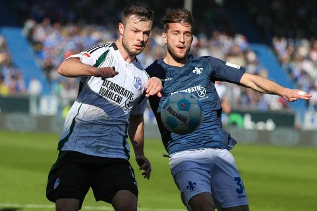 Darmstadt, Germany February 23, 2025 2 Liga 2024 2025 SV Darmstadt 98 vs FC Schalke 04 In the picture from left in a duel Adrian Gantenbein Schalke, 17 and Killian Corredor Darmstadt, 34 , DFL regulations prohibit any use of photographs as image sequences and or quasi video Merck Stadion am Böllenfalltor Hessen Copyright: xFotostandx xUlrichxScherbaumx