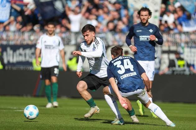 Darmstadt, Germany February 23, 2025 2 Liga 2024 2025 SV Darmstadt 98 vs FC Schalke 04 In the picture from left in a duel Mehmet Can Aydin Schalke, 23 and Killian Corredor Darmstadt, 34 , DFL regulations prohibit any use of photographs as image sequences and or quasi video Merck Stadion am Böllenfalltor Hessen Copyright: xFotostandx xUlrichxScherbaumx