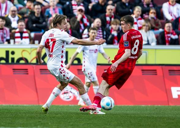 Cologne, RheinEnergieStadion, 23 02 2025 Mathias Olesen of Koeln challenges Johannesson Isak Bergmann of Duesseldorf during the 2 Bundesliga match 1 FC Koeln vs Fortuna Duesseldorf