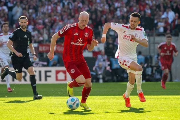 23 02 2025, Soccer 2 Bundesliga, Season 2024 2025, Matchday 23, 1 FC Koeln Fortuna Duesseldorf at RheinEnergieStadion in Koeln duel between Valgeir Lunddal Fridriksson Fortuna Duesseldorf, 12 and Dejan Ljubicic 1 FC Koeln, 07 Important note In accordance with the regulations of the DFL German Football League and the DFB German Football Association, it is prohibited to utilize or have utilized photographs taken in the stadium or of the match in the form of sequential images or video-like photo series Foto Kirchner Media Thomas Haesler Copyright: xKirchner-Media ThomasxHaeslerx
