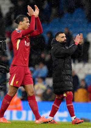 Manchester, England, 23rd February 2025. Virgil van Dijk of Liverpool and Mohamed Salah of Liverpool applaud the fans during the Manchester City v Newcastle United Premier League match at the Etihad Stadium, Manchester. Picture credit should read: Andrew Yates Sportimage EDITORIAL USE ONLY. No use with unauthorised audio, video, data, fixture lists, club league logos or live services. Online in-match use limited to 120 images, no video emulation. No use in betting, games or single club league player publications. SPI_076_AY_MAN_CITY_LIVERPOOL SPI-3697-0076
