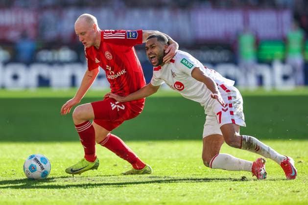 23 02 2025, Football, 1 FC Köln Fortuna Düsseldorf, 2 Fußball Bundesliga, Matchday 23, RheinEnergie STADION, Saison 2024 2025 Valgeir Lunddal Fridriksson Fortuna Düsseldorf 12 in duel against Linton Maina FC Köln 37 DFB regulations prohibit any use of photographs as image sequences and or quasi video Nordrhein Westfalen Germany