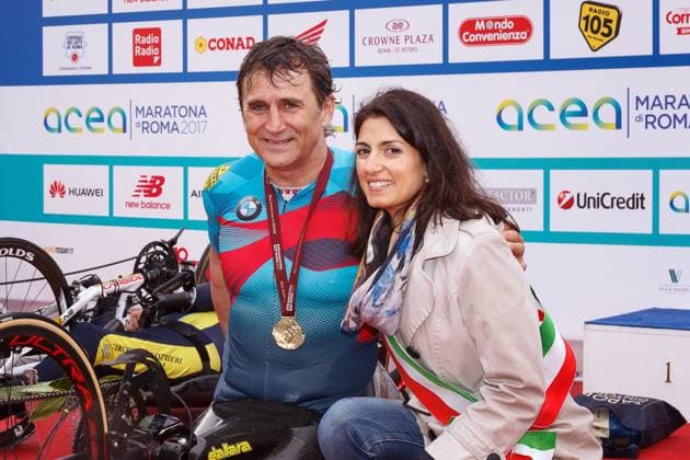Alex Zanardi 23rd Rome Marathon Rome, Italy - April 2, 2017: Alex Zanardi is the winner of the hand bike race of 23rd Rome Marathon. On stage together with the mayor Virginia Raggi during the award ceremony. Rome RM Italy Copyright: xGennaroxLeonardix