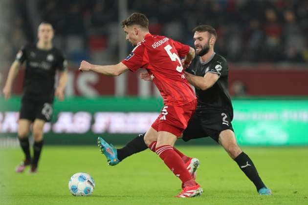 Moritz Heyer Fortuna Duesseldorf and Simon Asta SpVgg Greuther Fürth battle for the ball during the 2 Bundesliga match between Fortuna Duesseldorf and SpVgg Greuther Fürth at Merkur Spiel Arena on February 28, 2025 in Duesseldorf, Germany, Germany Photo by Oliver Kaelke DeFodi Images Moritz Heyer Fortuna Duesseldorf and Simon Asta SpVgg Greuther Fürth battle for the ball during the 2 Bundesliga match between Fortuna Düsseldorf and SpVgg Greuther Fürth at Merkur Spiel Arena on February 28, 2025 in Düsseldorf, Germany Photo by Oliver Kaelke DeFodi Images DFB DFL REGULATIONS PROHIBIT ANY USE OF PHOTOGRAPHS AS IMAGE SEQUENCES AND OR QUASI VIDEO Photo by Oliver Kaelke DeFodi Images