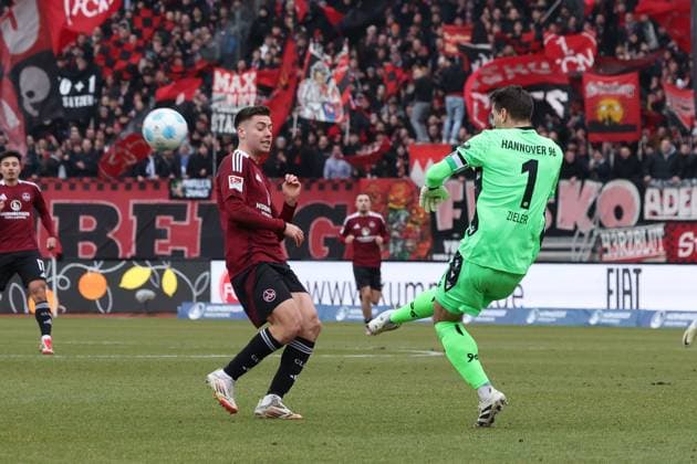 in duel, action, with Stefanos Tzimas 9 1 FC Nuernberg , Ron Robert Zieler 1 Hannover 96 , 1 FC Nuernberg vs Hannover 96, Soccer, 2 Bundesliga, 24 Matchday, 01 03 2025 DFB regulations prohibit any use of photographs as image sequences and or quasi video Nuernberg Bayern Germany Copyright: xkolbert-press MartinxAgüerax