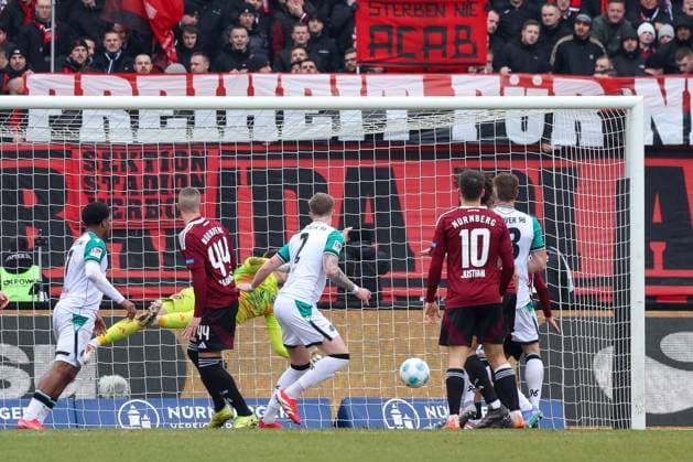 in duel, action, with Josh Knight Hannover 96 2 , but Jan Reichert 1FC Nuernberg 1 parried, 1 FC Nuernberg vs Hannover 96, Football, 2 Bundesliga, 24 Matchday, 01 03 2025 DFB regulations prohibit any use of photographs as image sequences and or quasi video Nuernberg Bayern Germany Copyright: xkolbert-press MartinxAgüerax