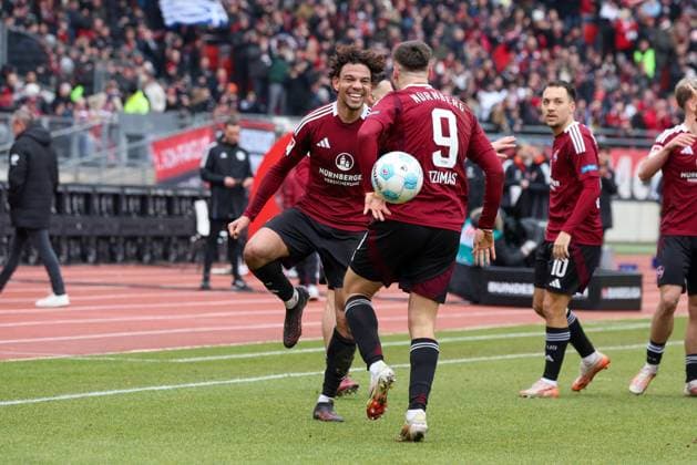 Goal celebration by Janis Antiste 28 1 FC Nuernberg , Stefanos Tzimas 9 1 FC Nuernberg to 1 0 1 FC Nuernberg vs Hannover 96, Soccer, 2 Bundesliga, 24 Matchday, 01 03 2025 DFB regulations prohibit any use of photographs as image sequences and or quasi video Nuernberg Bayern Germany Copyright: xkolbert-press MartinxAgüerax