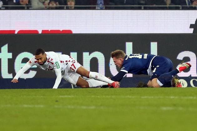 01.03.2025, xrekx, Fussball 2.Bundesliga, Karlsruher SC - 1.FC Köln v.l. Linton Maina (1.FC Koeln) Mikkel Kaufmann (Karlsruher SC) Zweikampf, Aktion, action, battle for the ball (DFL DFB REGULATIONS PROHIBIT ANY USE OF PHOTOGRAPHS as IMAGE SEQUENCES and or QUASI-VIDEO) Karlsruhe