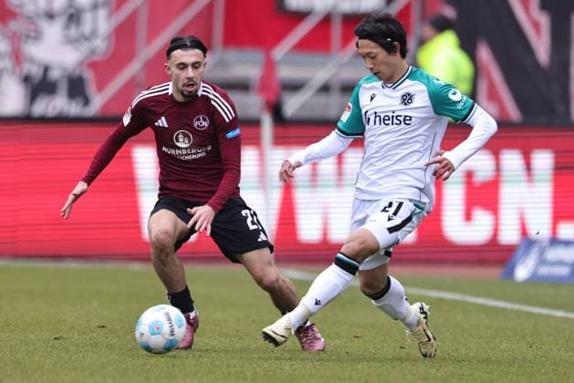 Berkay Yilmaz, FCN, and Sei Muroya, HÂ 96, in the second round match of the 2024 2025 season between 1 FC Nuremberg and Hannover 96 1 2 in Nuremberg 01 03 2025