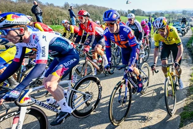 British Sean Flynn of Team Picnic PostNL and Belgian Wout van Aert of Team Visma-Lease a Bike pictured in action during the Kuurne-Brussels-Kuurne one day cycling race, 196,9 km from Kuurne to Kuurne via Brussels, Sunday 02 March 2025. DIRKxWAEM  x114010564x