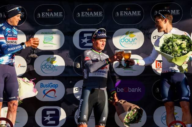 French Paul Magnier of Soudal Quick-Step, Dutch Mathieu van der Poel of Alpecin-Deceuninck and French Emilien Jeanniere of TotalEnergies pictured on the podium after the Ename Samyn Classic one day cycling race, 199,1km from Quaregnon to Dour on Tuesday 04 March 2025. VIRGINIExLEFOUR  x114223623x