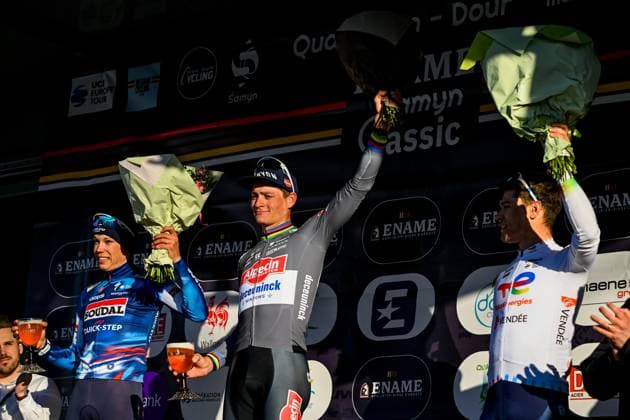 Dutch Mathieu van der Poel of Alpecin-Deceuninck and French Emilien Jeanniere of TotalEnergies celebrates on the podium after winning the Ename Samyn Classic one day cycling race, 199,1km from Quaregnon to Dour on Tuesday 04 March 2025. TOM GOYVAERTS TomxGoyvaerts  x114223875x