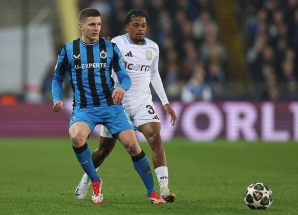 Brugge, Belgium, 4th March 2025. Christos Tzolis of Club Brugge and Leon Bailey of Aston Villa challenge for the ball during the UEFA Champions League match Club Brugge vs Aston Villa at Jan Breydel Stadium, Brugge. Picture credit should read: Paul Terry Sportimage EDITORIAL USE ONLY. No use with unauthorised audio, video, data, fixture lists, club league logos or live services. Online in-match use limited to 120 images, no video emulation. No use in betting, games or single club league player publications. SPI_027_PT_Brugge_Aston_Villa SPI-3725-0022