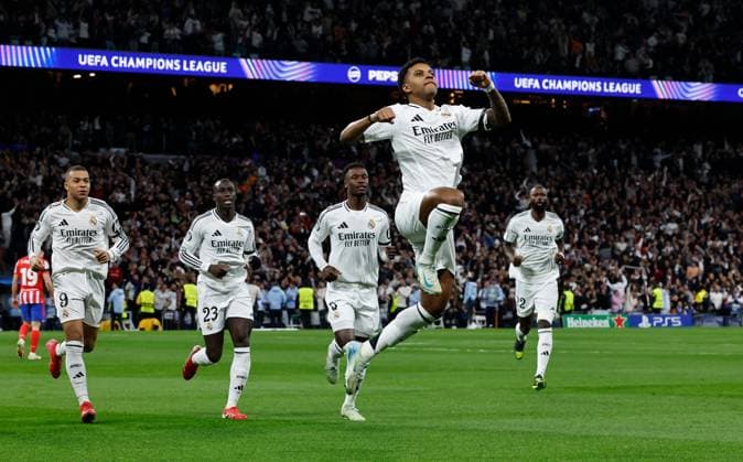 Rodrygo of Real Madrid celebrates scoring the opening goal Real Madrid v Atletico Madrid , UEFA Champions League, Round of 16, First Leg, Football, Santiago Bernabeu, Madrid, Spain - 04 Mar 2025 EDITORIAL USE ONLY No use with unauthorised audio, video, data, fixture lists, club league logos or live services. Online in-match use limited to 120 images, no video emulation. No use in betting, games or single club league player publications. Copyright: xRubenxAlbarran Shutterstockx 15178301ah