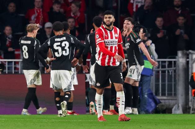 2025-03-04 PSV v Arsenal FC - UEFA Champions League 2024 25 Round of 16 First Leg EINDHOVEN, NETHERLANDS - MARCH 4: Ismael Saibari of PSV looks dejected after conceding his sides third goal, in the background Mikel Merino of Arsenal FC celebrates after scoring his teams third goal during the UEFA Champions League 2024 25 Round of 16 First Leg match between PSV and Arsenal FC at PSV Stadion on March 4, 2025 in Eindhoven, Netherlands. Eindhoven PSV Stadion Netherlands Content not available for redistribution in The Netherlands directly or indirectly through any third parties. Copyright: xBenxGalx