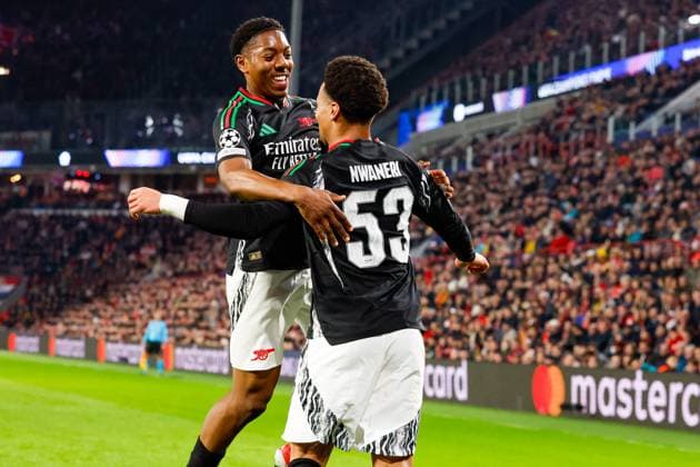 Ethan Nwaneri Arsenal FC celebrating the 0-2 with Myles Lewis-Skelly Arsenal FC , UEFA Champions League 2024 25 Round of 16 First Leg, PSV Eindhoven v Arsenal FC, Philips Stadion, March 4, 2025, Eindhoven, Netherlands.