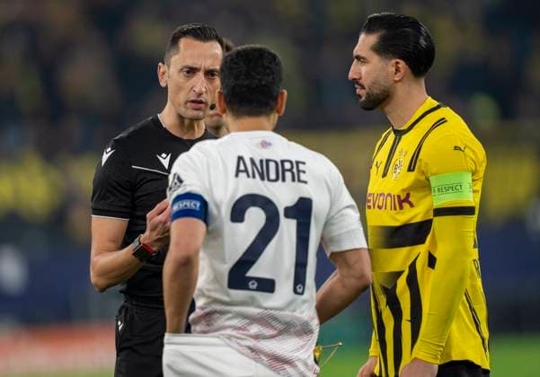Jose Maria Sanchez Martinez Referee, Spain discusses with Benjamin Andre OSC Lille, 21 and Emre Can Borussia Dortmund, 23 Borussia Dortmund vs OSC Lille, Football, UEFA Champions League, Round of 16, Season 2024 2025, 04 03 2025 DFL regulations prohibit any use of photographs as image sequences and or quasi video Copyright: HMBxMedia xMarcoxBader