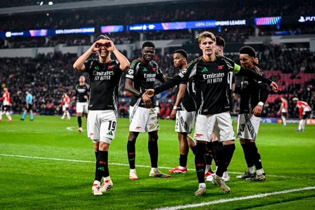 Arsenal midfielder Leandro Trossard, Arsenal midfielder Martin Odegaard celebrating the goal 1 5, during the match PSV Arsenal at the Philips stadium for the UEFA Champions League Round of 16 1st leg season 2024 2025 in EINDHOVEN, Netherlands on 4 march 2025, photo by Stefan Koops EYE4images DeFodi Images