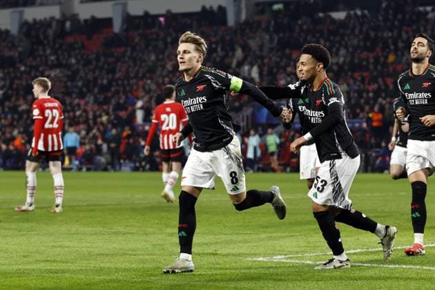 EINDHOVEN - Martin Odegaard of Arsenal FC celebrates 1-4 during the UEFA Champions league match between PSV Eindhoven and Arsenal FC at Phillips Stadium on March 4, 2025 in Eindhoven, Netherlands. ANP MAURICE VAN STEEN UEFA Champions League 2024 25 Round of 16 First leg 2024 25 xVIxANPxSportx xxANPxIVx 521572312 originalFilename: 521572312.jpg