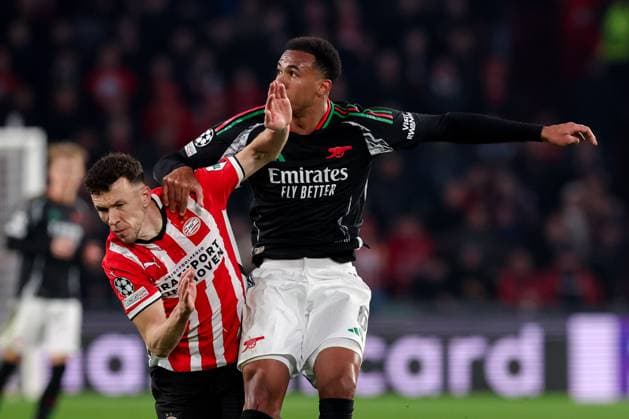 2025-03-04 PSV v Arsenal FC - UEFA Champions League 2024 25 Round of 16 First Leg EINDHOVEN, NETHERLANDS - MARCH 4: Ivan Perisic of PSV battles for possession with Gabriel Magalhaes of Arsenal FC during the UEFA Champions League 2024 25 Round of 16 First Leg match between PSV and Arsenal FC at PSV Stadion on March 4, 2025 in Eindhoven, Netherlands. Eindhoven PSV Stadion Netherlands Content not available for redistribution in The Netherlands directly or indirectly through any third parties. Copyright: xBenxGalx